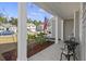 Cozy front porch with seating and an American flag, overlooking a landscaped yard at 433 Cedarview Rd, Summerville, SC 29486