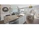 Modern kitchen features granite counters, stainless steel appliances, island seating, and open-concept to the living space at 433 Cedarview Rd, Summerville, SC 29486
