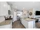 Bright kitchen with stainless steel appliances, a large granite island, and white cabinets, perfect for culinary enthusiasts at 433 Cedarview Rd, Summerville, SC 29486