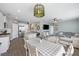 Open-concept living area featuring a stylish dining set, modern lighting, and a cozy sofa for a relaxed, inviting atmosphere at 433 Cedarview Rd, Summerville, SC 29486