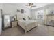 Inviting main bedroom with a plush bed, neutral decor, soft carpet, and a large window for natural light at 433 Cedarview Rd, Summerville, SC 29486