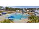 Stunning aerial view of a community pool with lounge chairs and umbrella-covered tables at 433 Cedarview Rd, Summerville, SC 29486