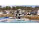 Community pool with winding slide and surrounding residences at 433 Cedarview Rd, Summerville, SC 29486