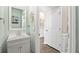 Stylish powder room with modern fixtures, elegant mirror, and fresh decor, conveniently located near the entryway at 433 Cedarview Rd, Summerville, SC 29486