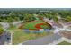 Aerial view of a pristine baseball field, complete with manicured turf and covered bleachers, situated in a recreational area at 4816 Chesterfield Rd, North Charleston, SC 29405