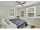 Bright bedroom featuring hardwood floors, natural lighting, and a comfortable bed at 4816 Chesterfield Rd, North Charleston, SC 29405
