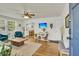 Cozy living room featuring hardwood floors, a ceiling fan, and natural light at 4816 Chesterfield Rd, North Charleston, SC 29405