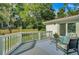 Inviting backyard deck with comfortable seating, overlooking a well-maintained lawn and offering serene outdoor relaxation at 5332 Parkside Dr, North Charleston, SC 29405