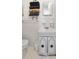 Bright bathroom featuring white fixtures, vanity and tiled walls at 5332 Parkside Dr, North Charleston, SC 29405