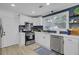 Modern kitchen with stainless steel appliances, white cabinetry, and stylish backsplash at 5332 Parkside Dr, North Charleston, SC 29405
