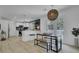Bright, modern kitchen features stainless steel appliances, white cabinetry, and a stylish breakfast nook with outside access at 5332 Parkside Dr, North Charleston, SC 29405