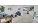 Open-concept living space with modern decor and seamless flow to kitchen area at 5332 Parkside Dr, North Charleston, SC 29405