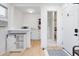 Bright living space with kitchenette, vinyl floors, modern features, and a view of the shower at 5332 Parkside Dr, North Charleston, SC 29405