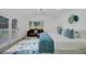 Bright main bedroom featuring a cozy seating area, large windows, and stylish accents for comfortable living at 5332 Parkside Dr, North Charleston, SC 29405