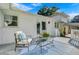 Spacious patio featuring comfortable seating, a vibrant rug, and direct access to the lush backyard and the house at 5332 Parkside Dr, North Charleston, SC 29405