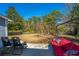 Inviting backyard patio with comfortable seating, overlooking a lush yard and scenic views at 613 Salterton St, Summerville, SC 29485