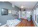 Spacious bedroom with hardwood floors, ample windows, and a cozy chair, perfect for relaxation at 613 Salterton St, Summerville, SC 29485