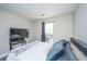 A bright bedroom with ample space, featuring a large window and comfortable decor at 613 Salterton St, Summerville, SC 29485