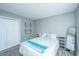 Well-lit bedroom with a queen-size bed and coastal accents, complemented by hardwood-style floors and closet at 613 Salterton St, Summerville, SC 29485