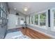 Bright bedroom with hardwood floors, lots of natural light, and neutral decor for a serene atmosphere at 613 Salterton St, Summerville, SC 29485