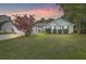 Charming single-story home with lush lawn and mature trees, perfect for suburban living at 613 Salterton St, Summerville, SC 29485