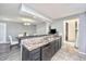 Galley kitchen with granite countertops and a view into the dining area at 613 Salterton St, Summerville, SC 29485