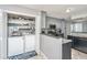 Spacious kitchen with laundry closet and modern appliances, providing convenience and style at 613 Salterton St, Summerville, SC 29485