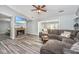 Comfortable living room boasts a brick fireplace and a sectional couch at 613 Salterton St, Summerville, SC 29485