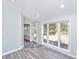 Sunroom with large windows and door leading to the backyard at 613 Salterton St, Summerville, SC 29485