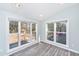 Bright sunroom with large windows offering views of the backyard at 613 Salterton St, Summerville, SC 29485