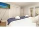 Bedroom featuring a television, ample closet space, ensuite access to a porch, and comfortable bed at 707 Palmetto Blvd, Edisto Island, SC 29438