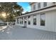 Expansive deck featuring white railings and a light gray floor with serene neighborhood views at 707 Palmetto Blvd, Edisto Island, SC 29438