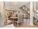 Dining area featuring open floor plan, stairs and adjacent kitchen with stainless steel appliances at 707 Palmetto Blvd, Edisto Island, SC 29438