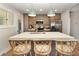 Well-lit kitchen showcases white countertops, cabinetry, sink, and modern stainless steel appliances at 707 Palmetto Blvd, Edisto Island, SC 29438