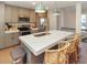 Modern kitchen features a white quartz countertop, grey cabinets, and stainless steel appliances at 707 Palmetto Blvd, Edisto Island, SC 29438