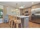 Kitchen island boasts ample countertop space, pendant lighting, and modern appliances at 707 Palmetto Blvd, Edisto Island, SC 29438