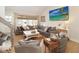 Comfortable living room with a large sectional couch, hardwood floors, and modern decor at 707 Palmetto Blvd, Edisto Island, SC 29438