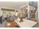 Bright living room with a vaulted ceiling, stylish furnishings, and a staircase at 707 Palmetto Blvd, Edisto Island, SC 29438