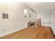 Bright loft featuring hardwood floors and three windows allowing natural light in at 707 Palmetto Blvd, Edisto Island, SC 29438