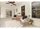 Inviting screened-in porch with stylish seating, decor, and serene outdoor views at 707 Palmetto Blvd, Edisto Island, SC 29438