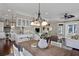 Bright dining area adjacent to living room with a modern light fixture at 720 Island Park Dr # 104, Charleston, SC 29492
