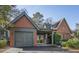 Charming home exterior with unique architectural details, a driveway, a garage, and manicured landscaping at 720 Island Park Dr # 104, Charleston, SC 29492