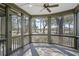 The screened porch overlooks lush green landscaping, providing a seamless transition between indoor and outdoor living spaces at 720 Island Park Dr # 104, Charleston, SC 29492