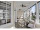 A cozy sunroom featuring lots of natural light, neutral color palette, and decorative ceiling fans at 720 Island Park Dr # 104, Charleston, SC 29492