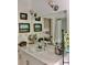 This bathroom features a large mirror, vanity lights, and coastal-themed decorations for a relaxing atmosphere at 7753 Blue House Ln, Edisto Island, SC 29438