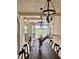 Open dining area featuring wood floors, a rustic dining table, and marsh views at 7753 Blue House Ln, Edisto Island, SC 29438