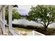 Relax on this charming porch with serene water views surrounded by lush greenery and peaceful ambiance at 7753 Blue House Ln, Edisto Island, SC 29438