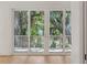 Sliding doors open to a private balcony surrounded by lush greenery at 806 Jungle Rd, Edisto Island, SC 29438