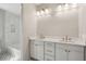 Bathroom featuring double vanity, modern lighting, and shower at 806 Jungle Rd, Edisto Island, SC 29438