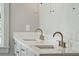 Modern bathroom featuring a double sink vanity, quartz countertop, and brushed brass fixtures at 806 Jungle Rd, Edisto Island, SC 29438